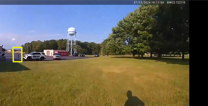 PA police pointing rifle at roof